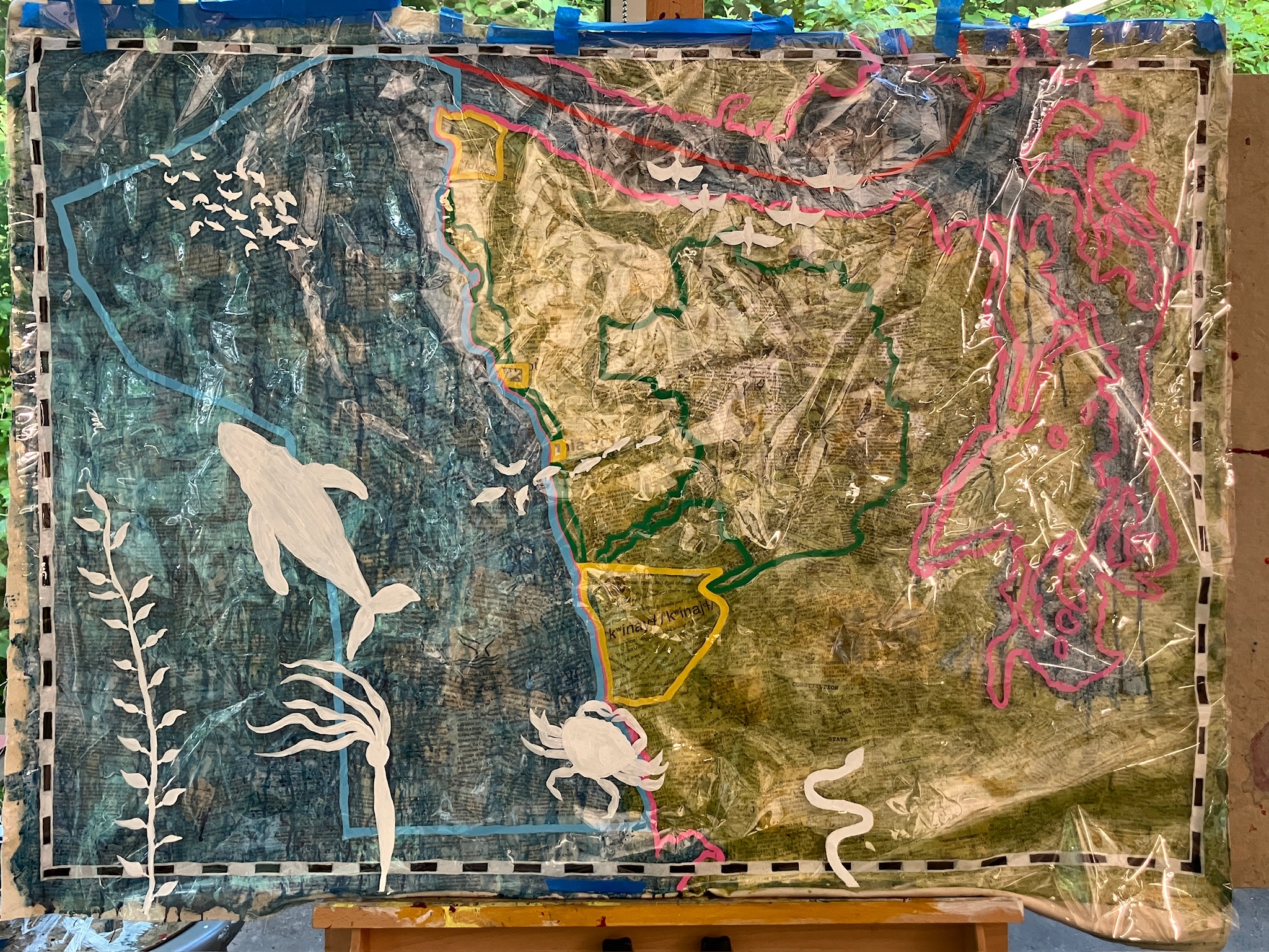 A map of the state of Washington, watercolor painted, with clear sheets on top showing
      political boundaries in neon colors and animal silhouettes in white.